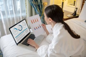 a woman is checking her bed and breakfast property management application